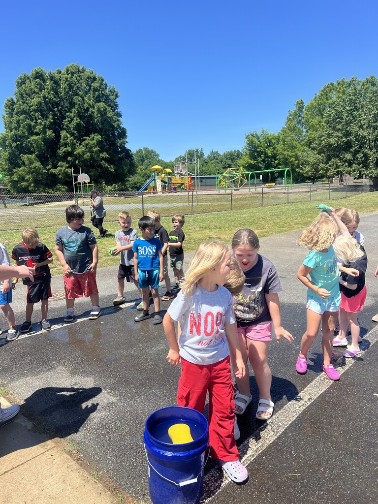 Students playing a water game during field day.