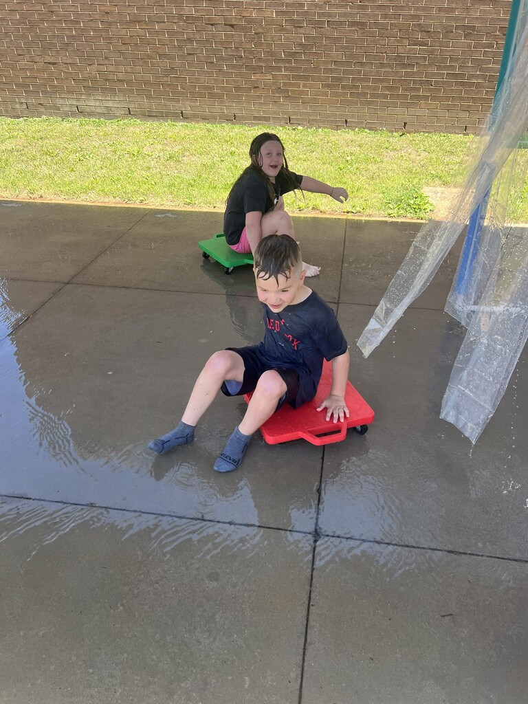 Students going through the car wash during field day.