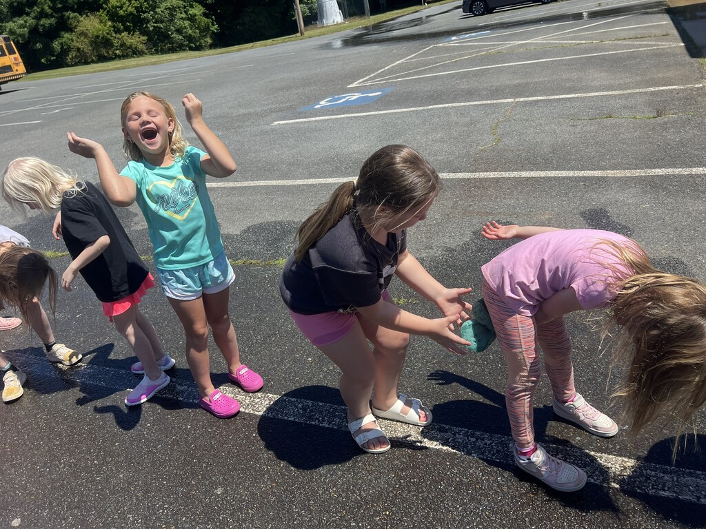 Students playing a water game during field day.