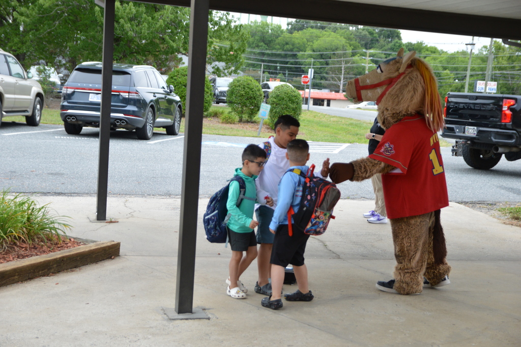 Horse mascot greets students and staff