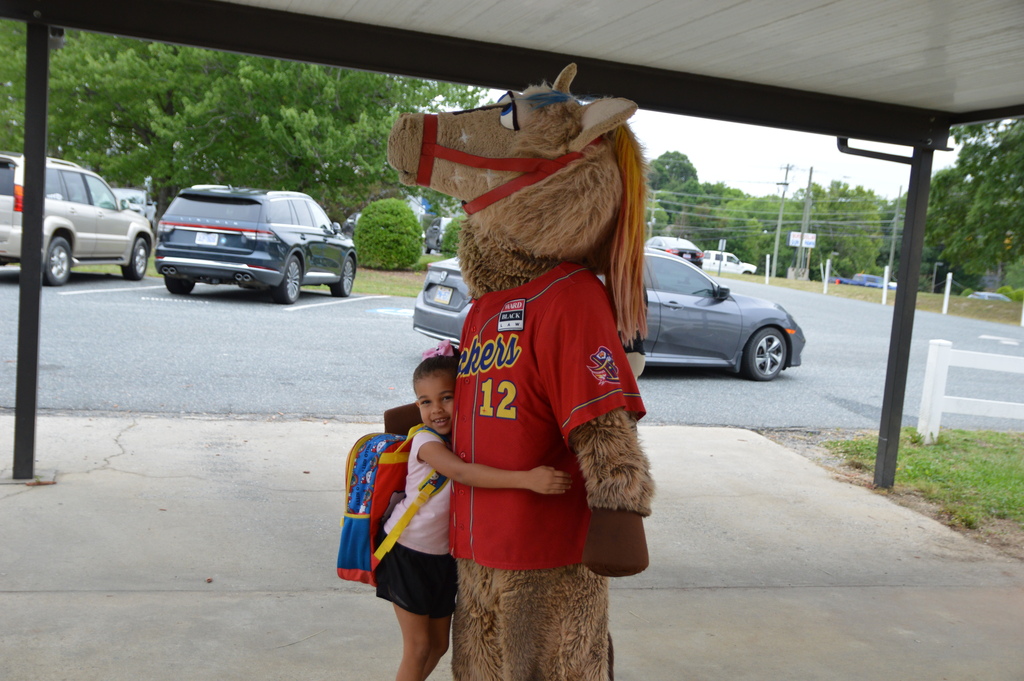 Horse mascot greets students and staff