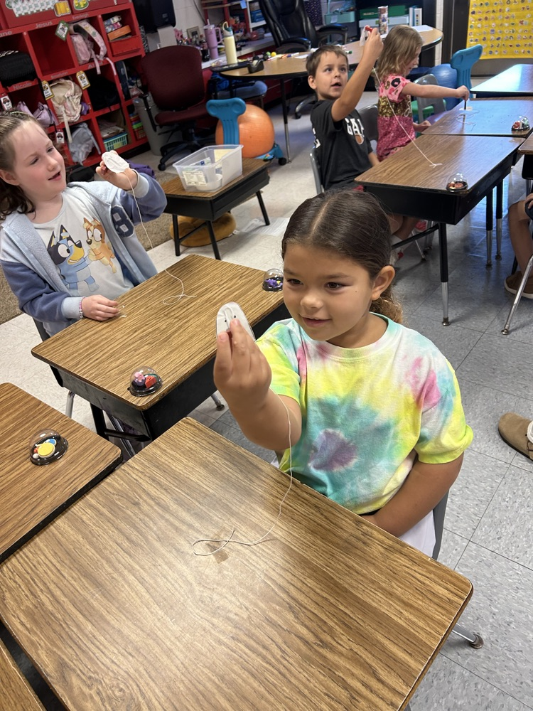 First grade has been learning about force and motion in science this week. Today, they did an experiment with magnets to see if they could make their ghost “fly” without touching it. 👻
