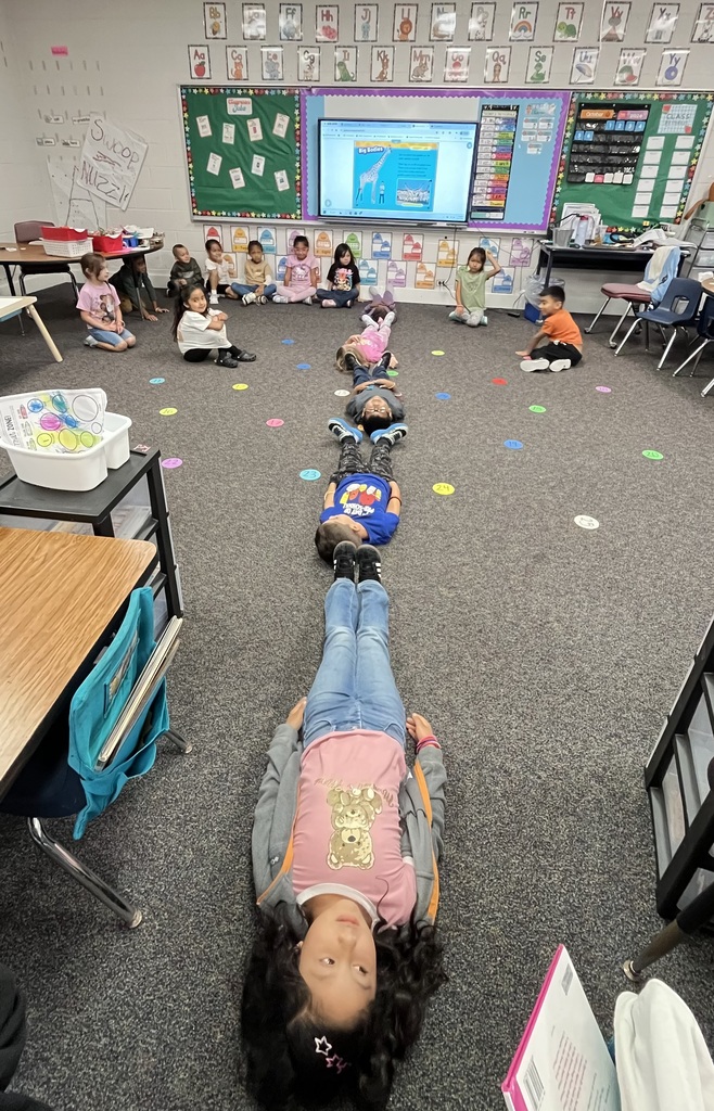 Measuring how tall a giraffe is at Ramseur Elementary -Kindergarten