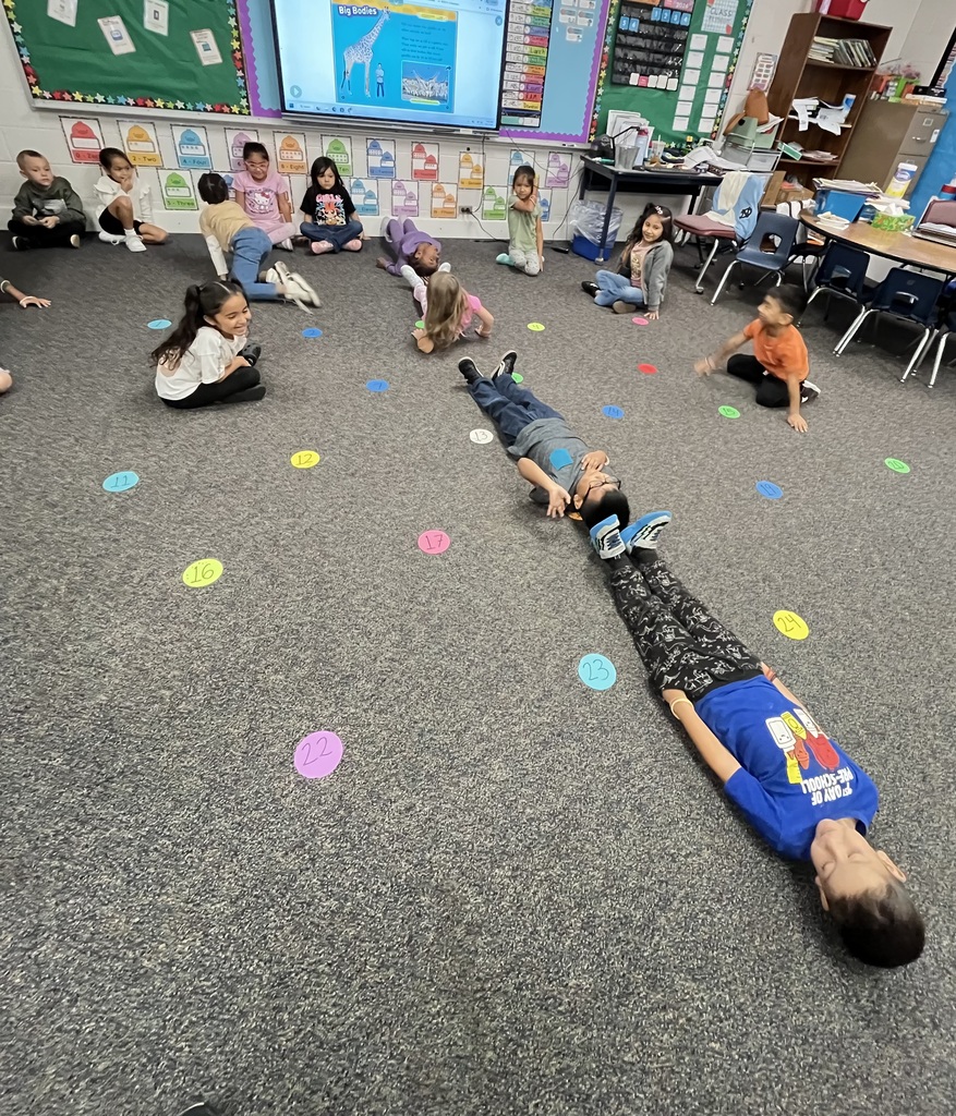 Measuring how tall a giraffe is at Ramseur Elementary -Kindergarten