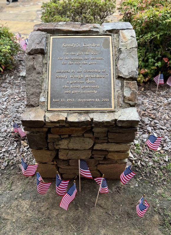 911 ceremony and students put flags in Sandy's Garden 