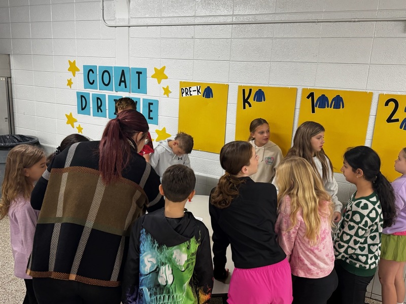 Student collecting, counting, and packing coats.