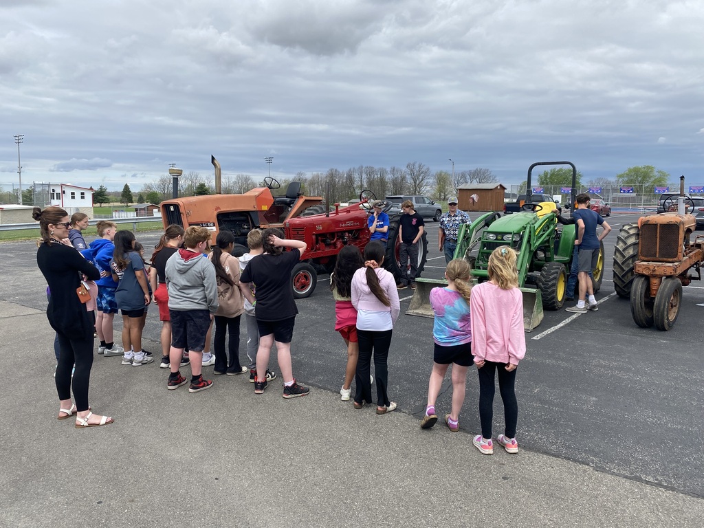 SHOWING TRACTORS TO STUDENTS