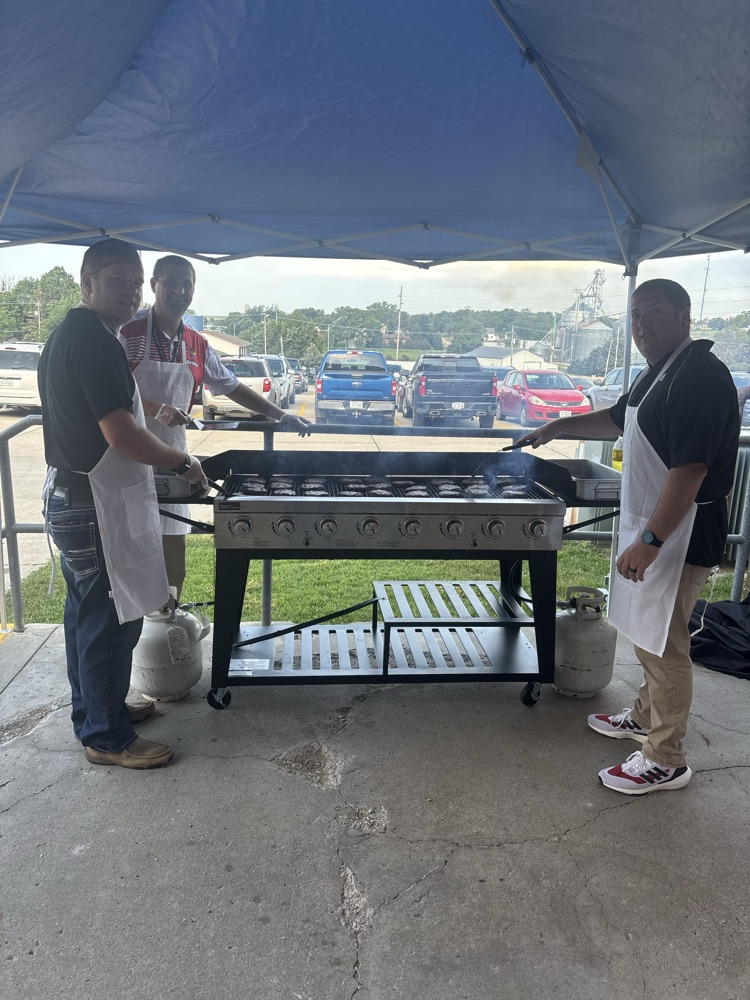 Grilling burgers for the Randolph Cardinals' students and staff!
