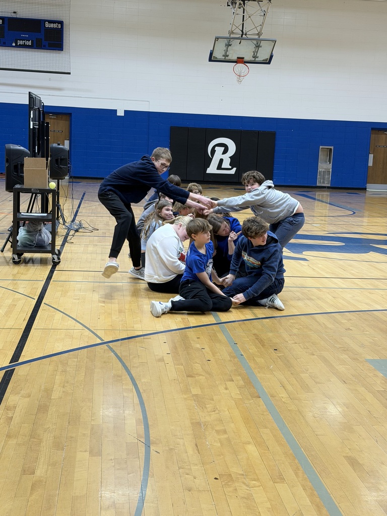 middle school students took part in a trust-building and teamwork activity during an assembly