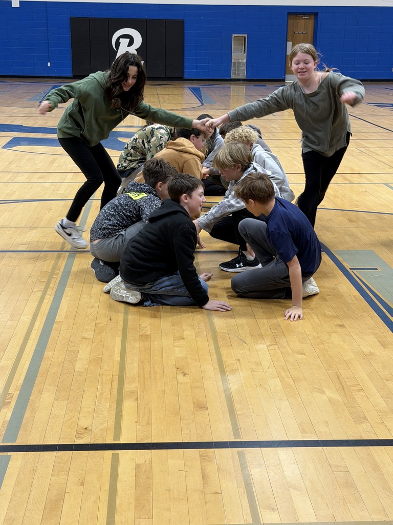 middle school students took part in a trust-building and teamwork activity during an assembly