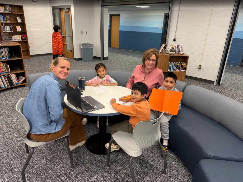 Title I Reading Specialist Aide Julie Neitzke and District ELL Support Specialist Wendy Hoffman working with some of our Kindergarten ELL students