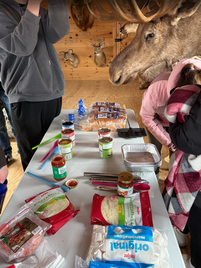 The Hatchet Club and American Wilderness Science class took their learning to the outdoor classroom, mastering the art of making a classic campfire treat—pudgy pies