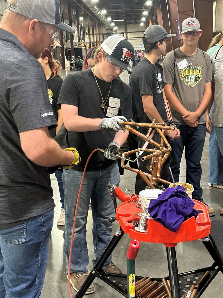 students trying welding 
