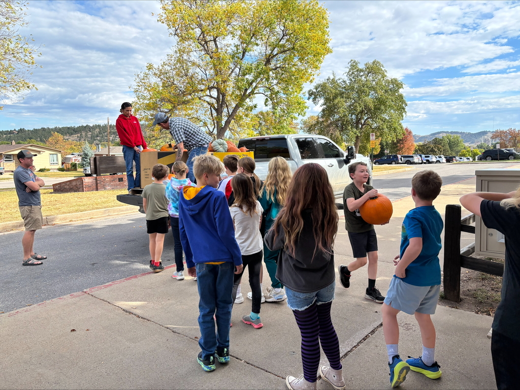 students helping unload