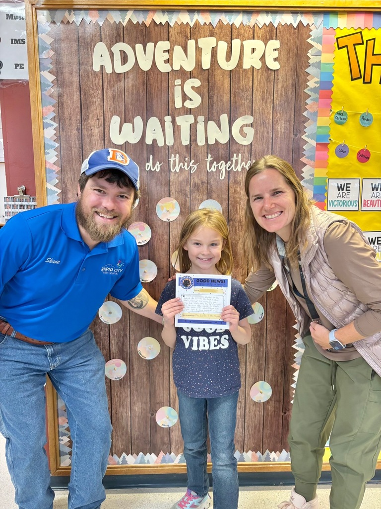 student and staff members smiling