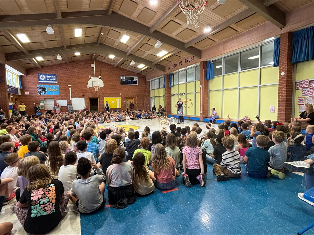 students watching hoop dancing