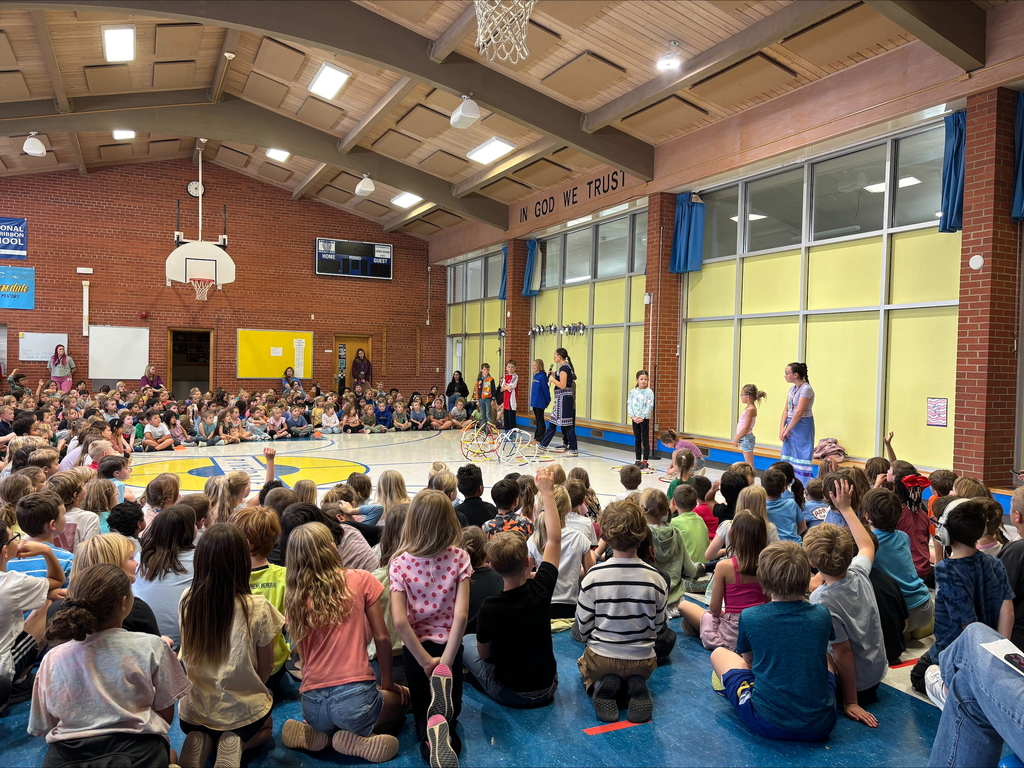 students watching hoop dancing