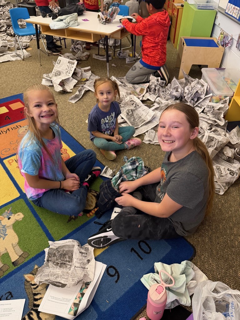 students making scarecrows 