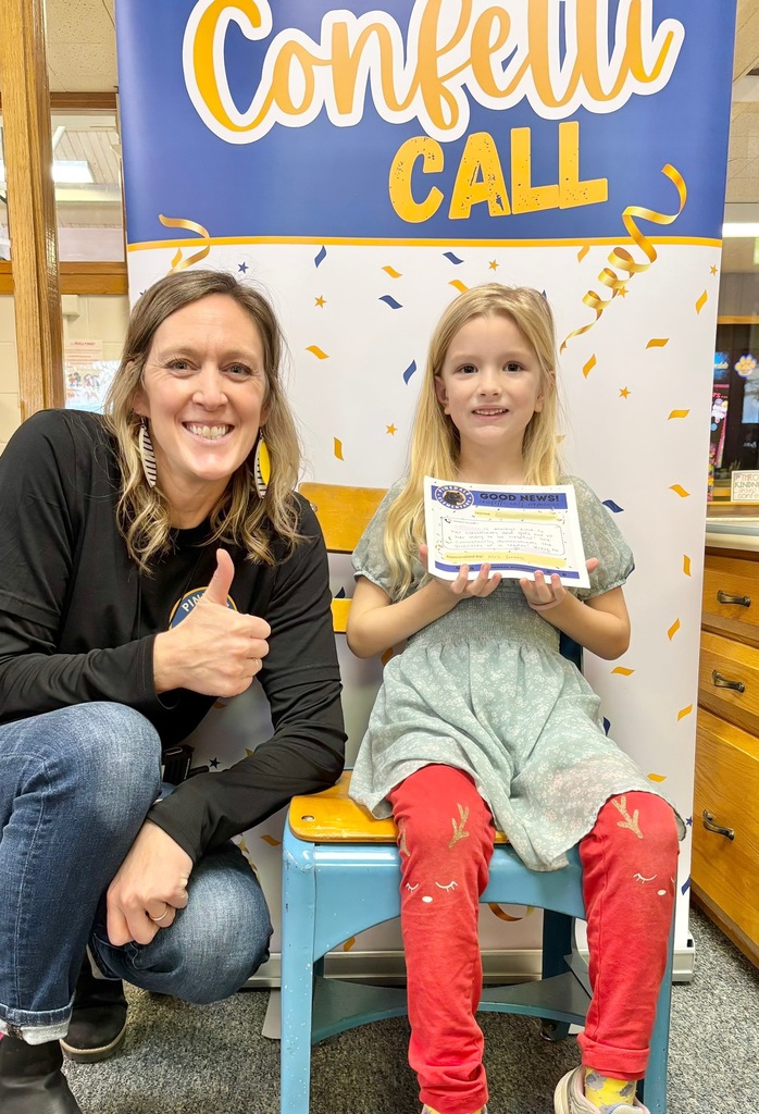 student and staff member smiling
