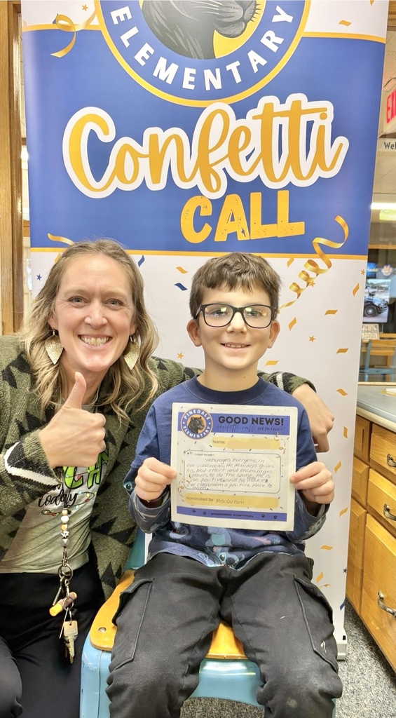 student and staff member smiling