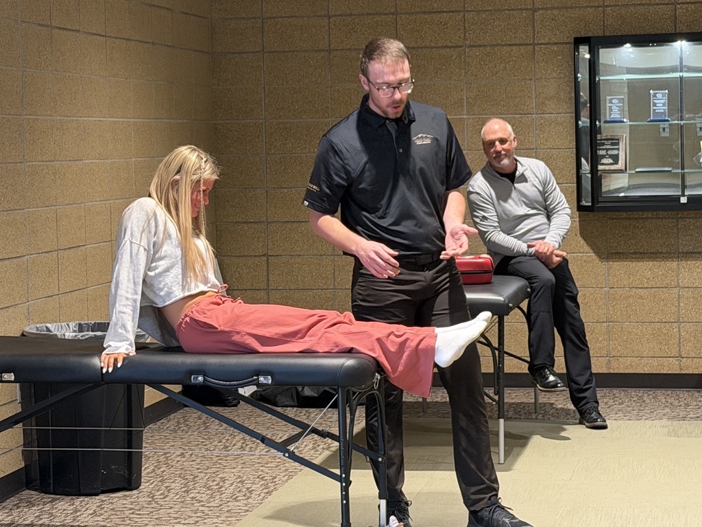 Student participating in demonstration for athletic training