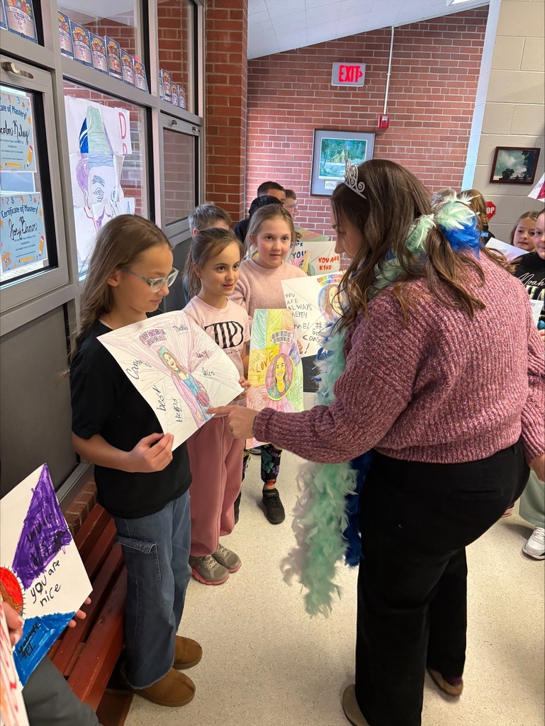 staff in hallway students celebrating