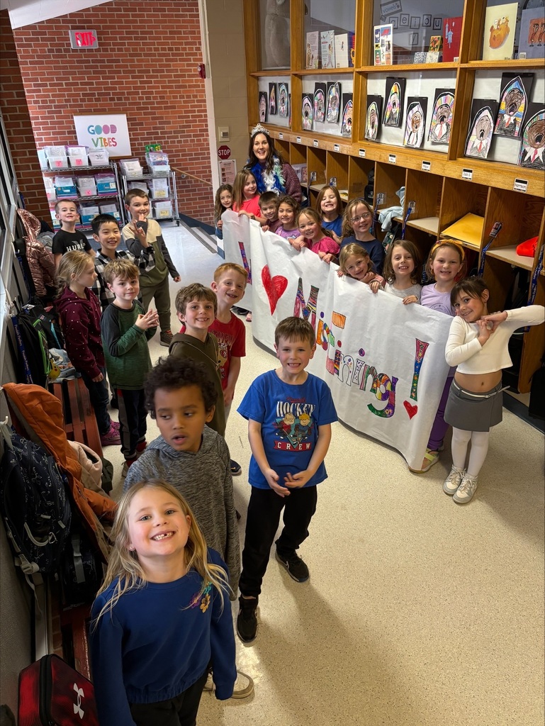 staff in hallway students celebrating