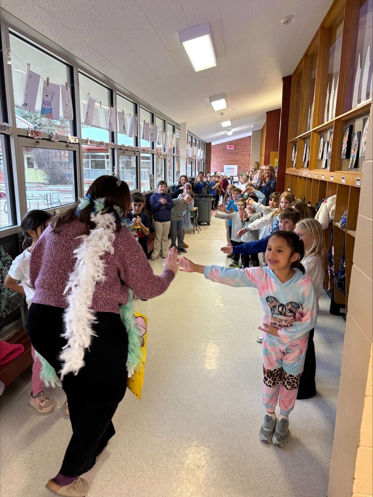 staff in hallway students celebrating