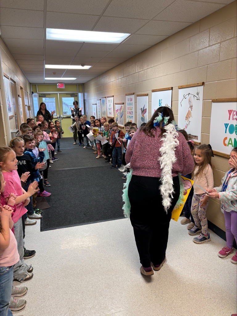 staff in hallway students celebrating