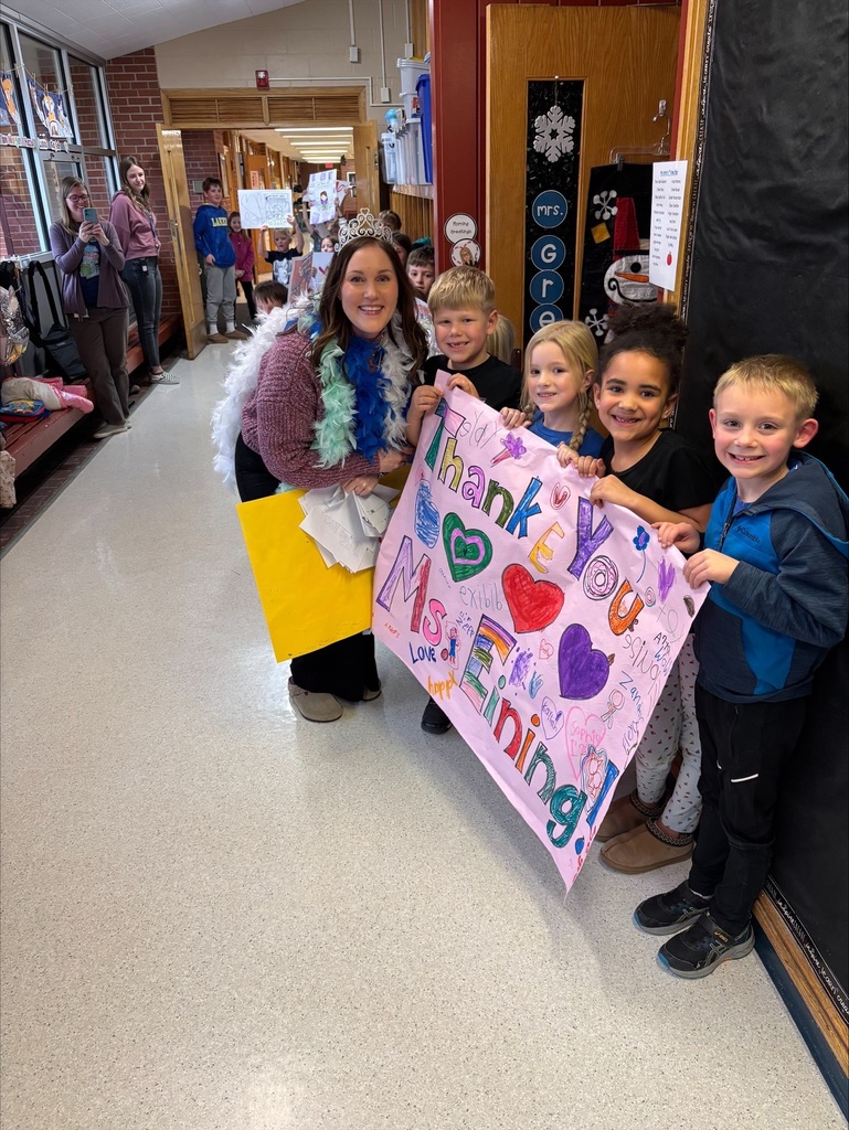 staff in hallway students celebrating