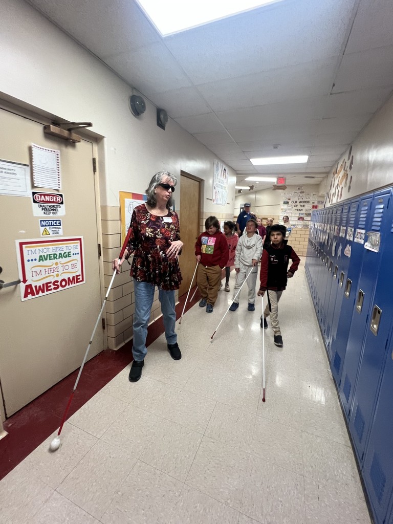students walking with white canes