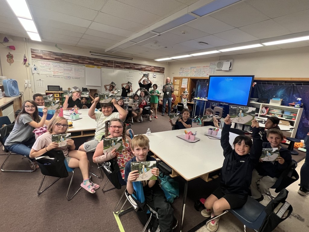students with their copy of "Grandpa's White Cane"