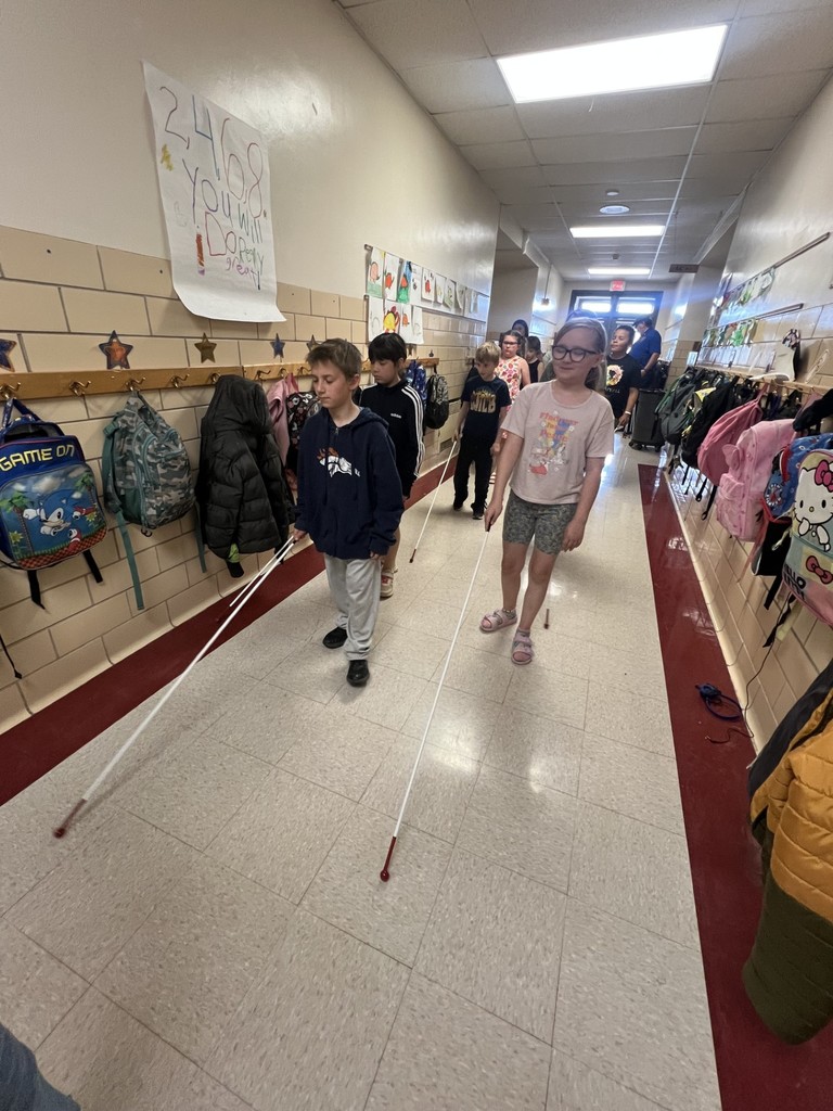 students walking with white canes