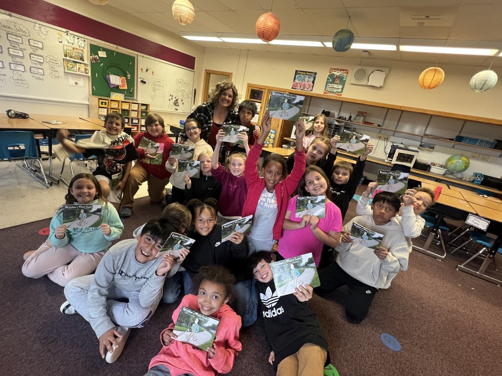 students with their copy of "Grandpa's White Cane"