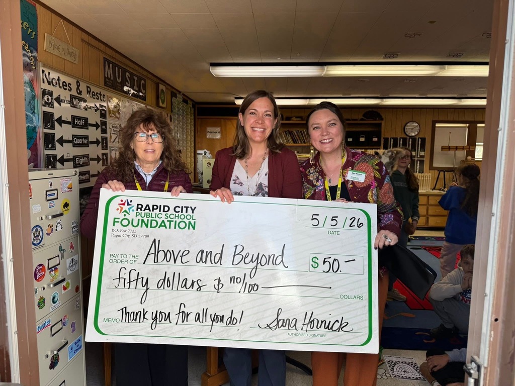 staff pic with large check