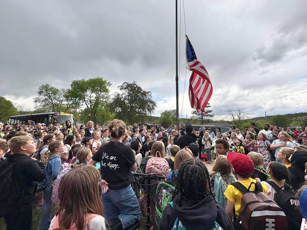 students at flag pole ceremony