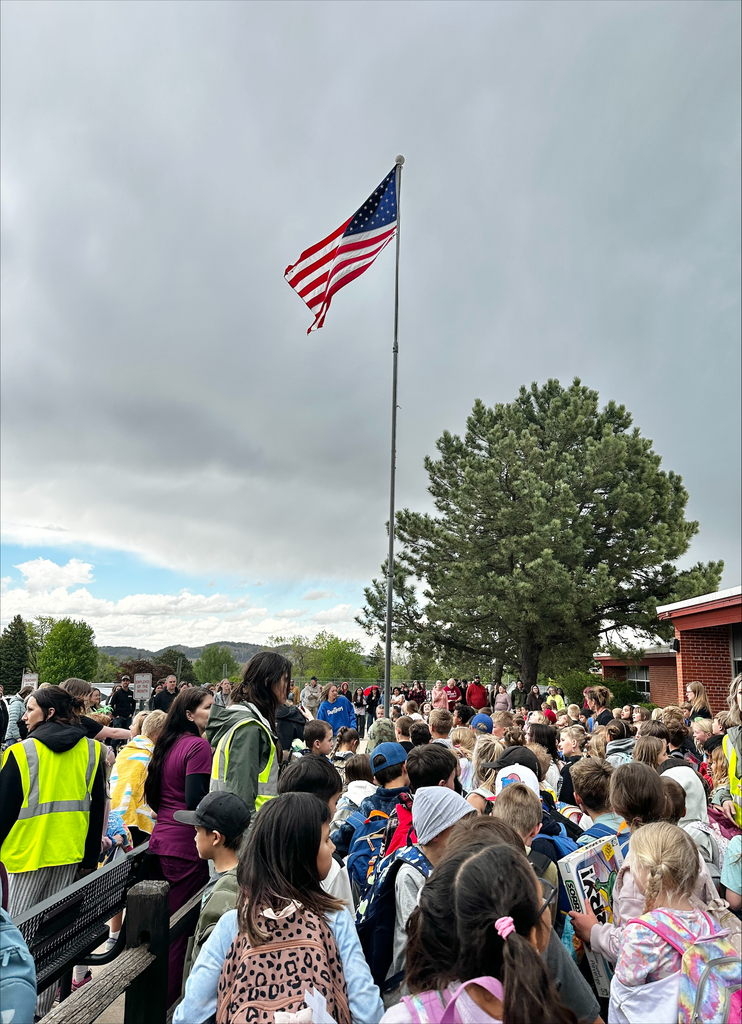 students at flag pole ceremony