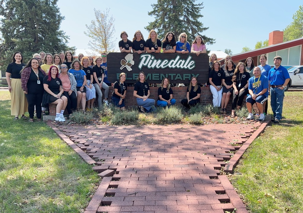 staff pic at school sign