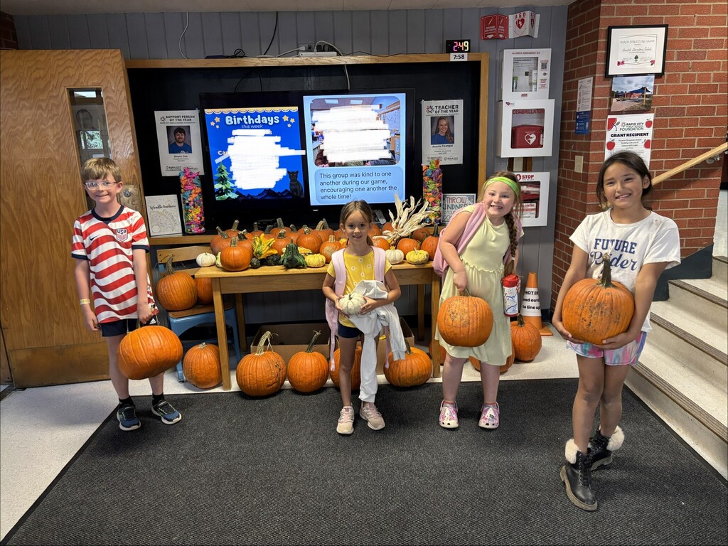 students with pumpkins