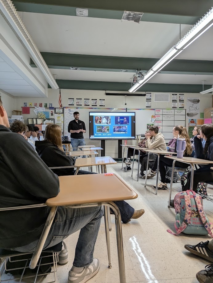 Alumni Zach Close speaking with HS Journalism Students