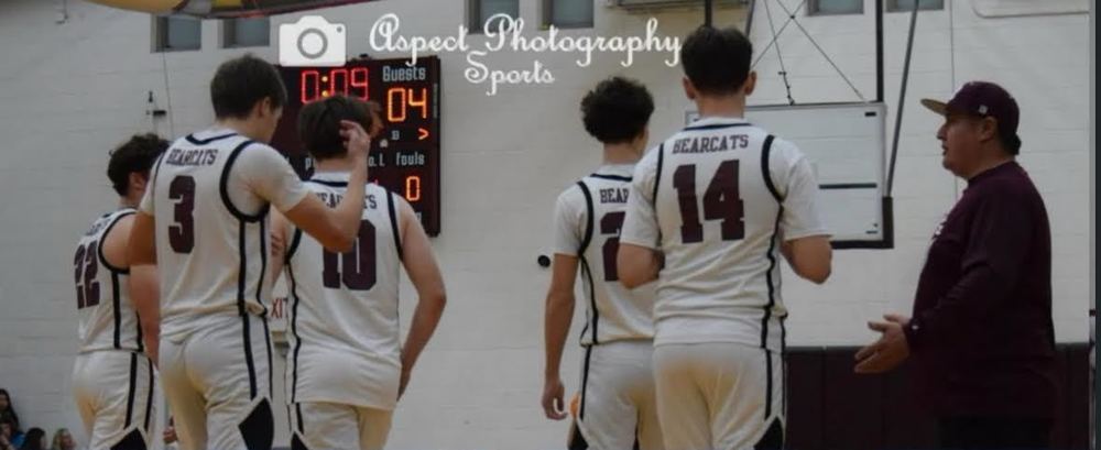 Players standing with coach