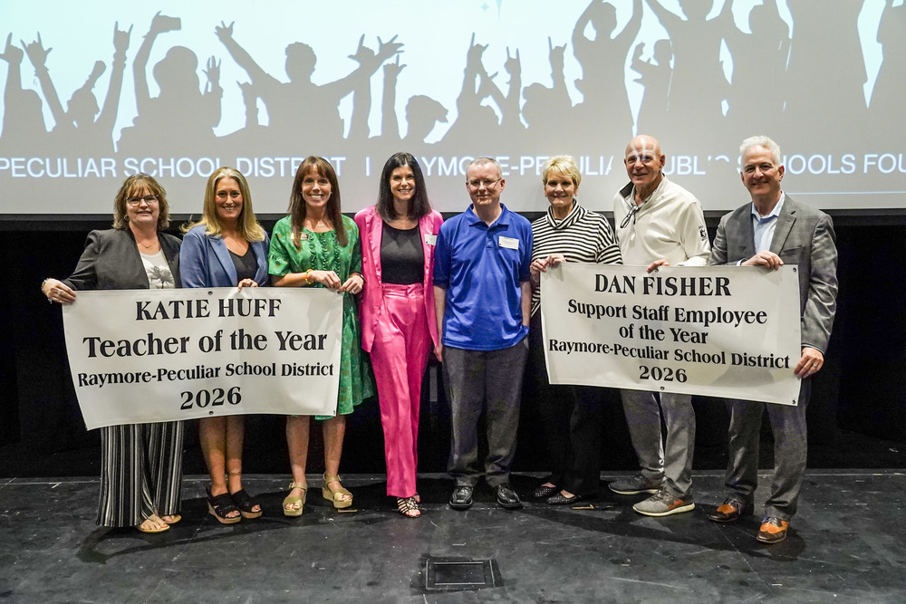 Katie Huff and Dan Fisher pose with Board of Education members.