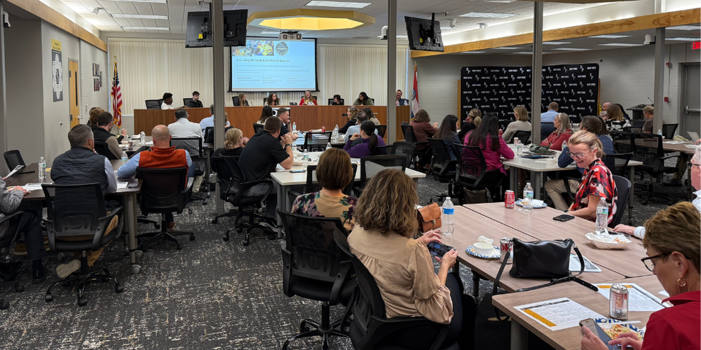 Educational Leaders visiting in the Ray Pec Board Room