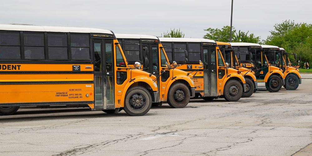 A line of yellow school buses