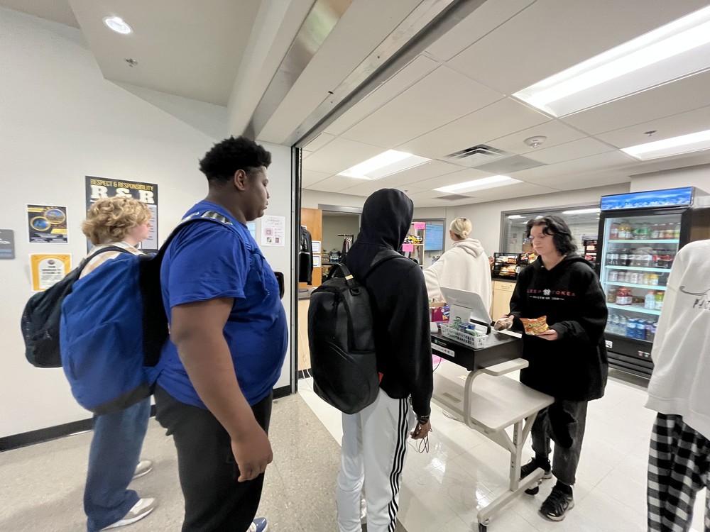 Student Lilith Sweet staffs the cash register and assists students in the Panther Market.