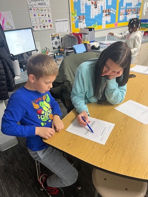 High School Student tutoring Elementary Student