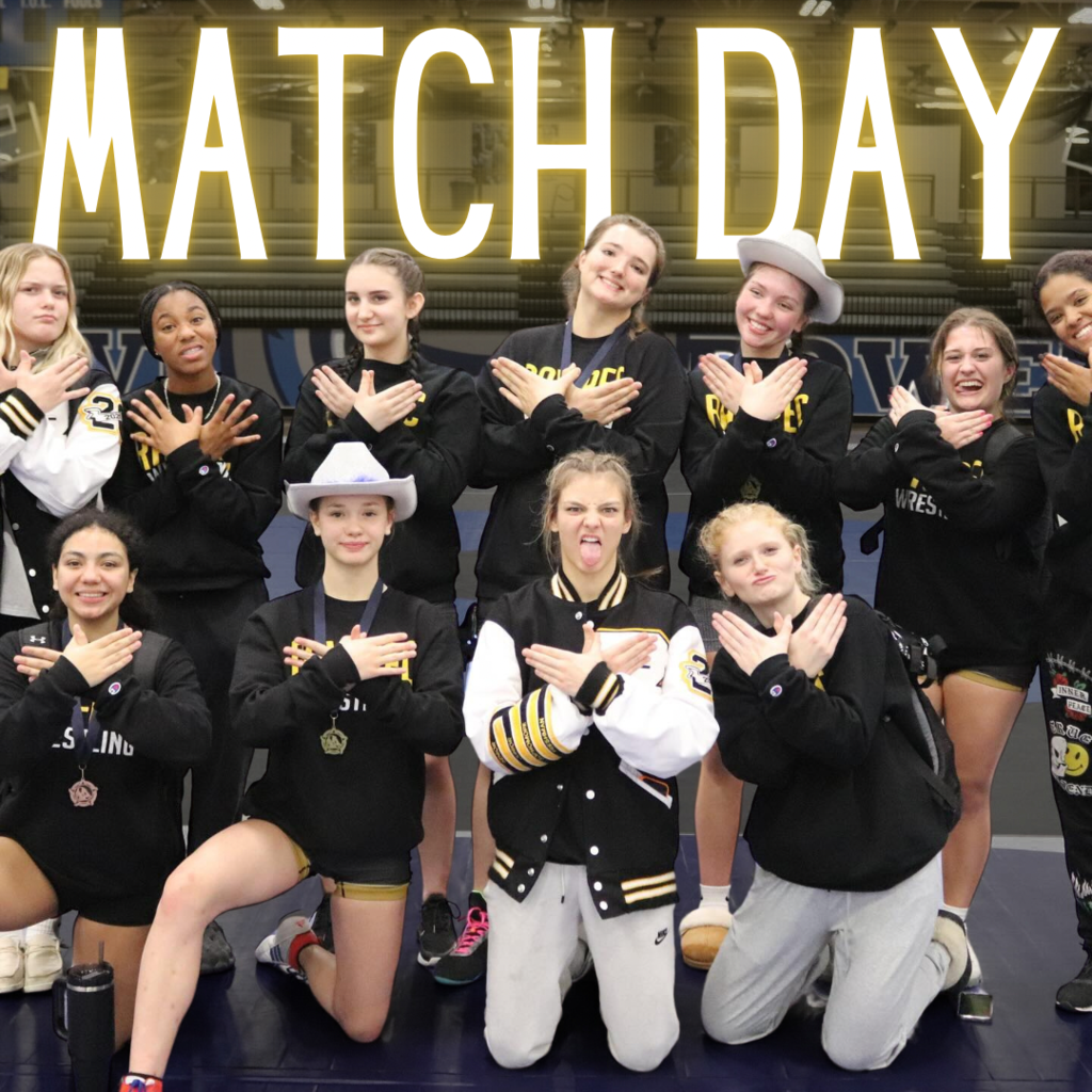 Match Day text behind a team photo of the girls' wrestling team