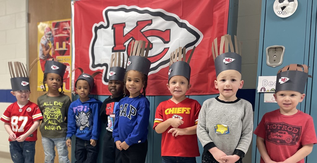 Children wearing Chiefs spirit wear.
