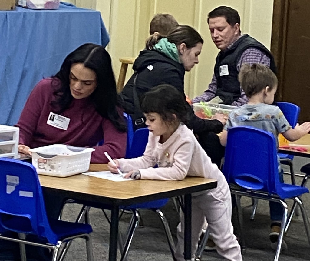 Students with special guests playing in the imagination station.