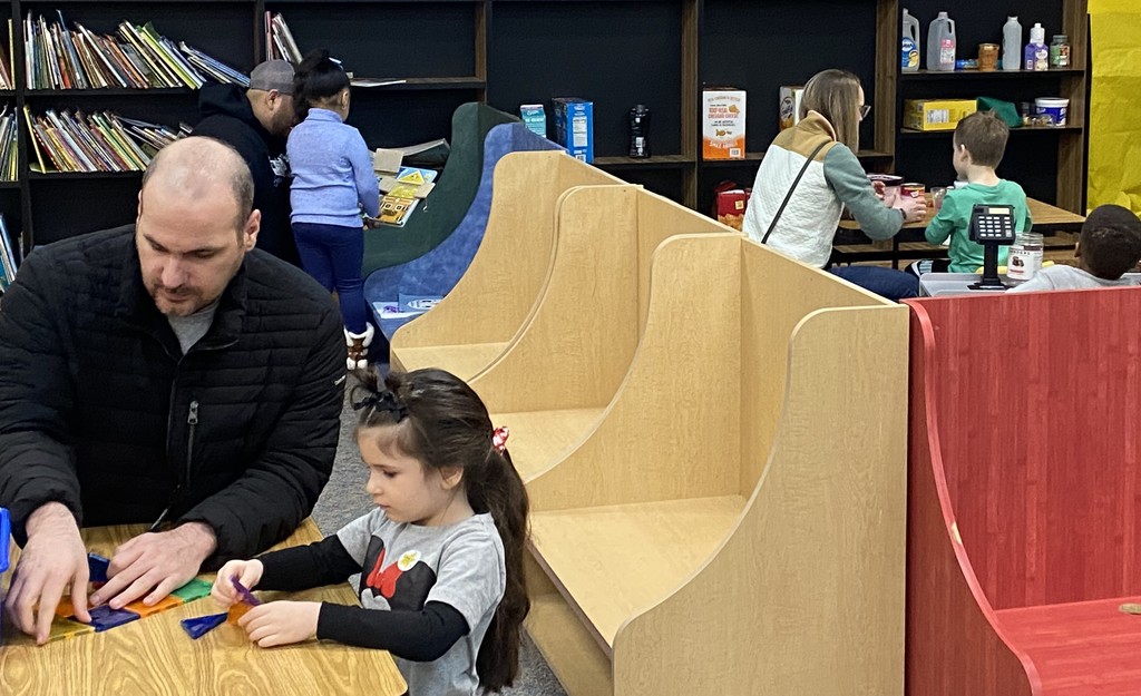 Special guests and children playing